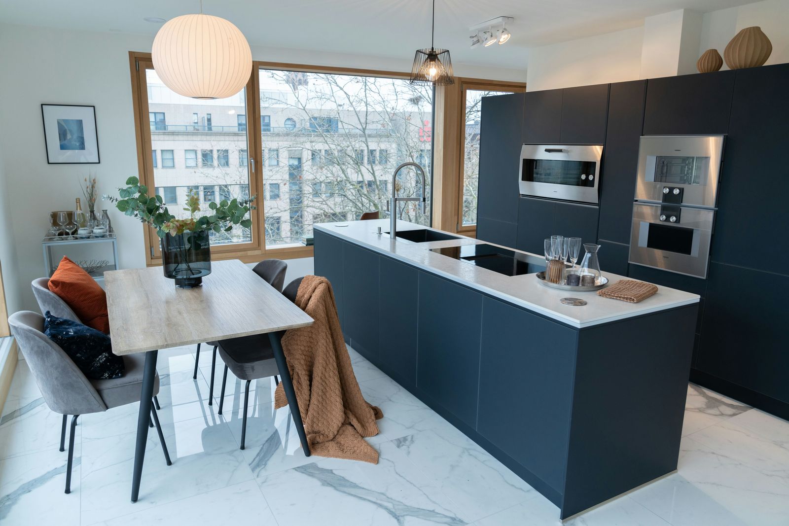 A kitchen with a view over the city